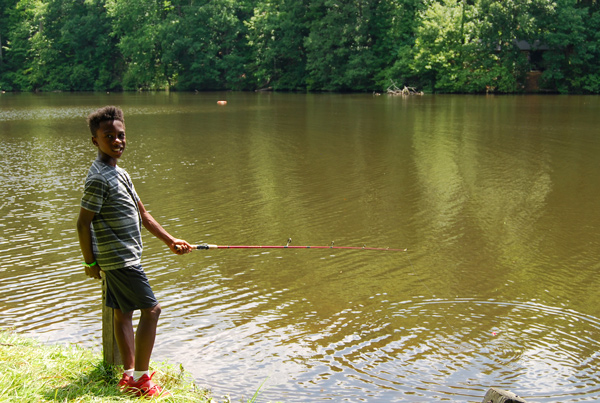 A child fishing at lake hazel. This pond is full of fish.