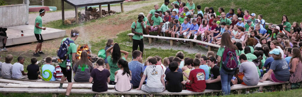 youth and counselors outside by the firepit