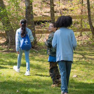 children walking through forest