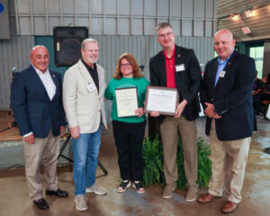 Stacy, the camp director with group after getting an award.