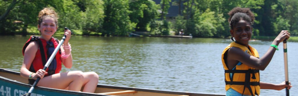 two girls in canoe on Lake Hazel