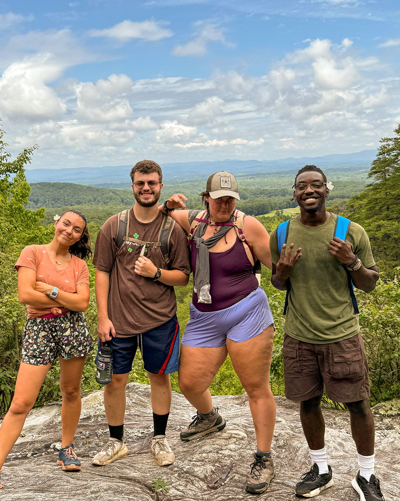 group of counselors hiking in the mountains