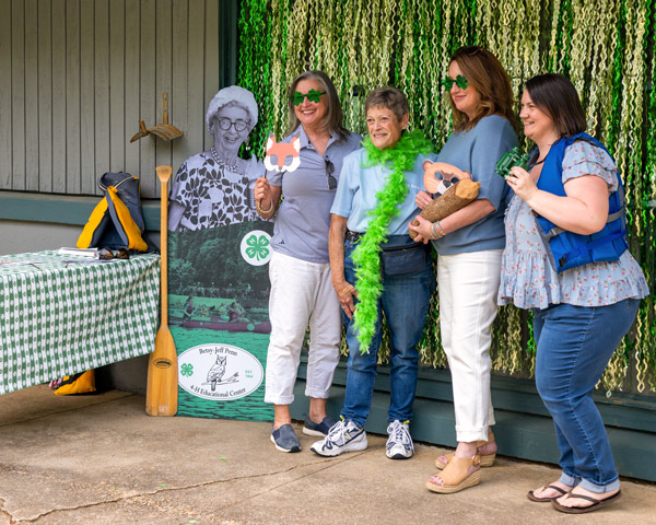 selfie station with group taking photo in front of tinsel