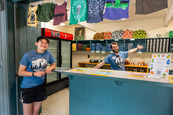 camp store with staff smiling